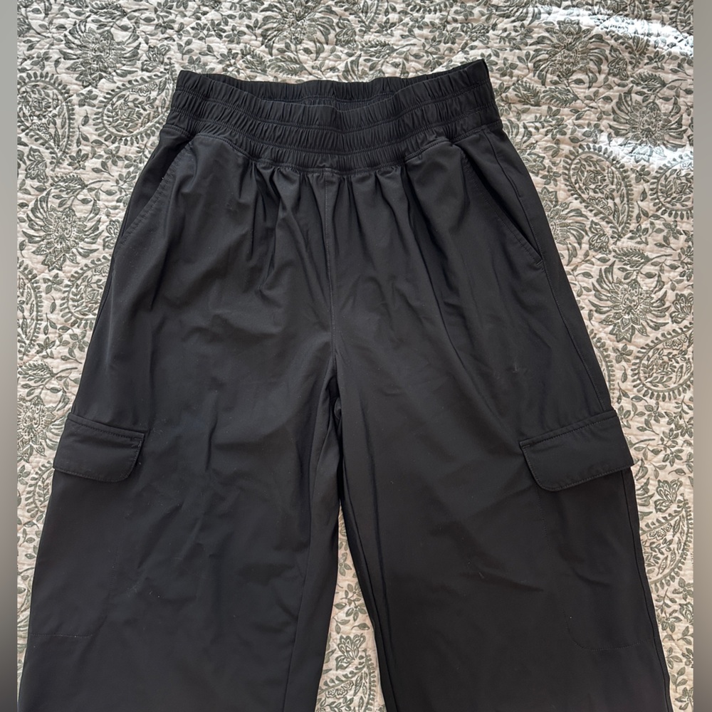 Women’s black athletic pants. Wide leg bottoms.